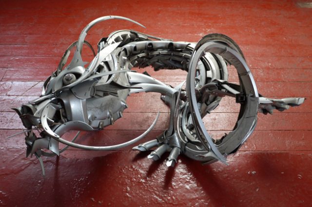 recycled sculpture scrap art green eco recycledart junk rubbish hubcap dragon dragons chinese